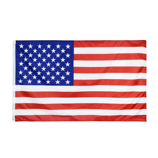 AmeriFlag™ embroidered U.S. flag displayed outdoors, showing stars and stripes waving in the wind