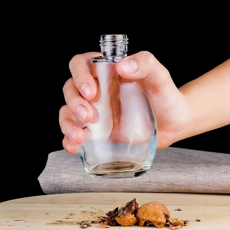SprayChef™ oil dispenser placed on a hard glass surface