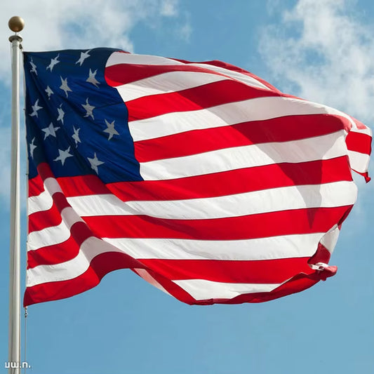 AmeriFlag™ embroidered U.S. flag waving proudly in the wind, ideal for outdoor patriotic display