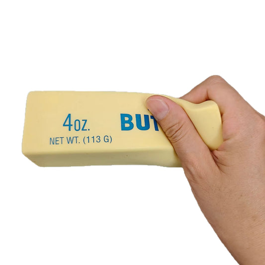 ButterPress™ memory foam stick squeezed by hand for instant stress relief