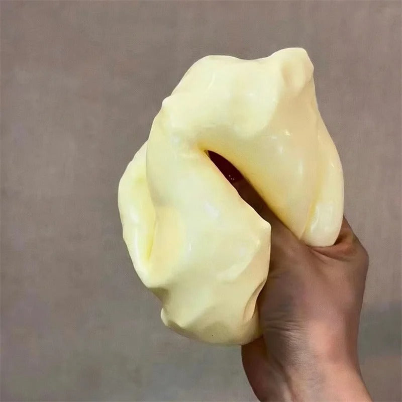 Detailed view of the elastic texture of the CheeseSqueeze™ ASMR accessory