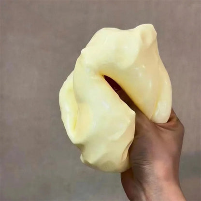Detailed view of the elastic texture of the CheeseSqueeze™ ASMR accessory