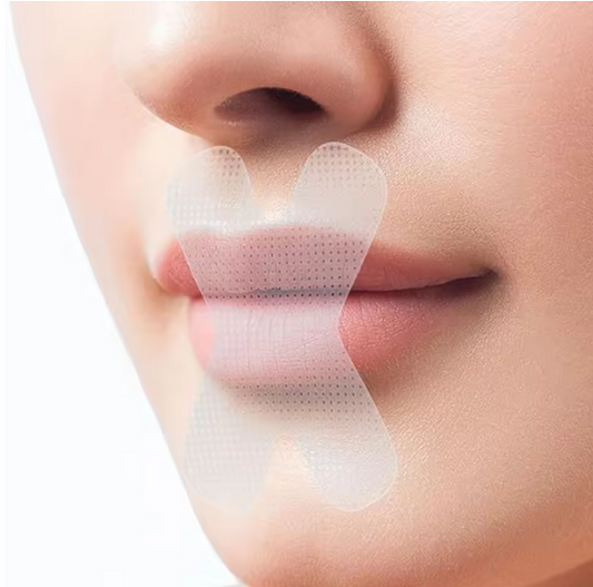 SilentSeal™ mouth tape gently applied on a person's lips during sleep, promoting nasal breathing and reducing snoring