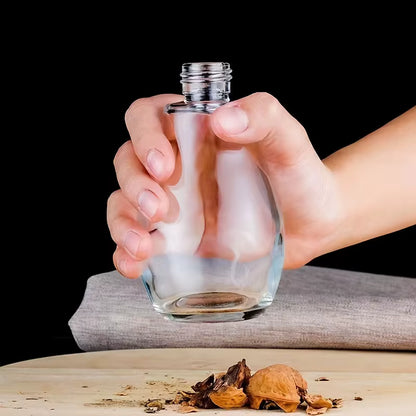 SprayChef™ oil dispenser placed on a hard glass surface